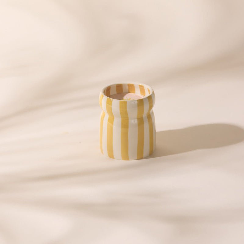 Find Cabana Ochre Striped Gold Coast Candle - Designworks at Bungalow Trading Co.